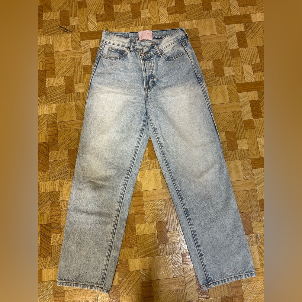 REVICE Classic Straight Leg Light Blue Jeans with Asymmetrical Waistband.